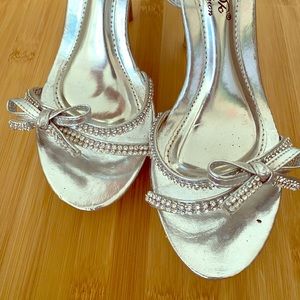 Silver heels with bows